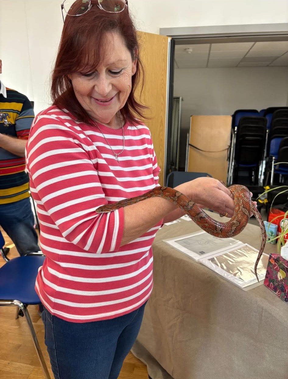 Zyta holding one of the snakes from her collection
